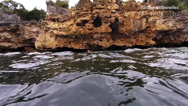 Nsfw slowmo backflip off rock cliff ends in back flop