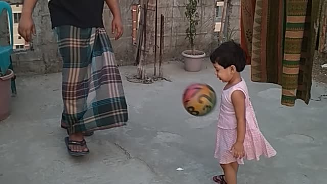 Father & Daughter Playing Football