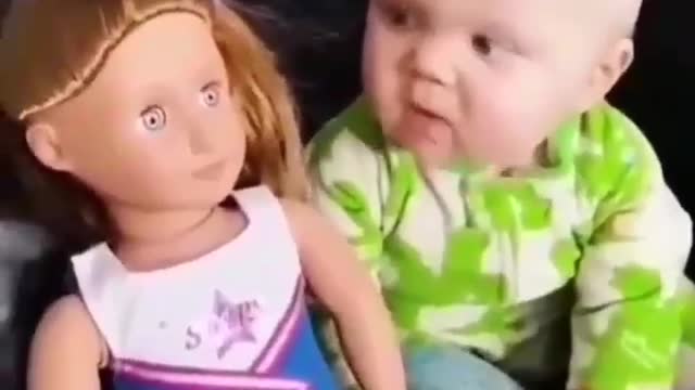 Little cute baby is surprised when he saw a doll beside him / his face is funny😁😜