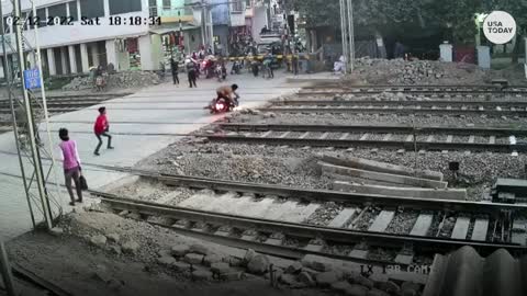 BIKER ALMOST HIT BY A TRAIN 😱