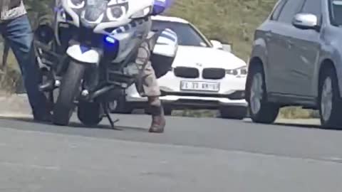 Cop Struggles to Mount Motorcycle