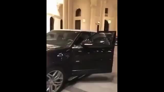 A Saudi girl driving a Range car in front of the Ritz-Carlton Hotel in Riyadh