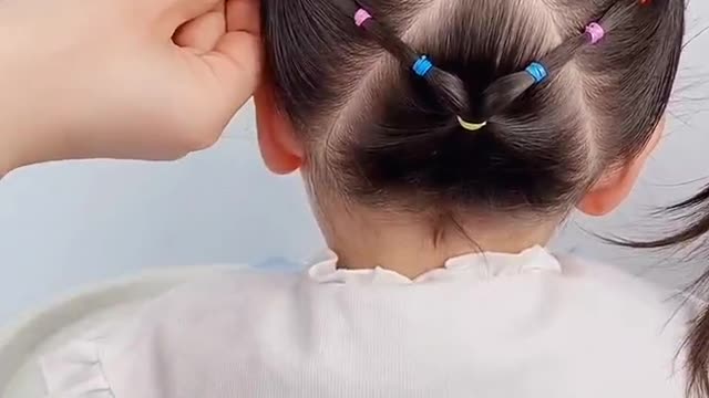 hair is braided into flowers