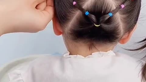 hair is braided into flowers