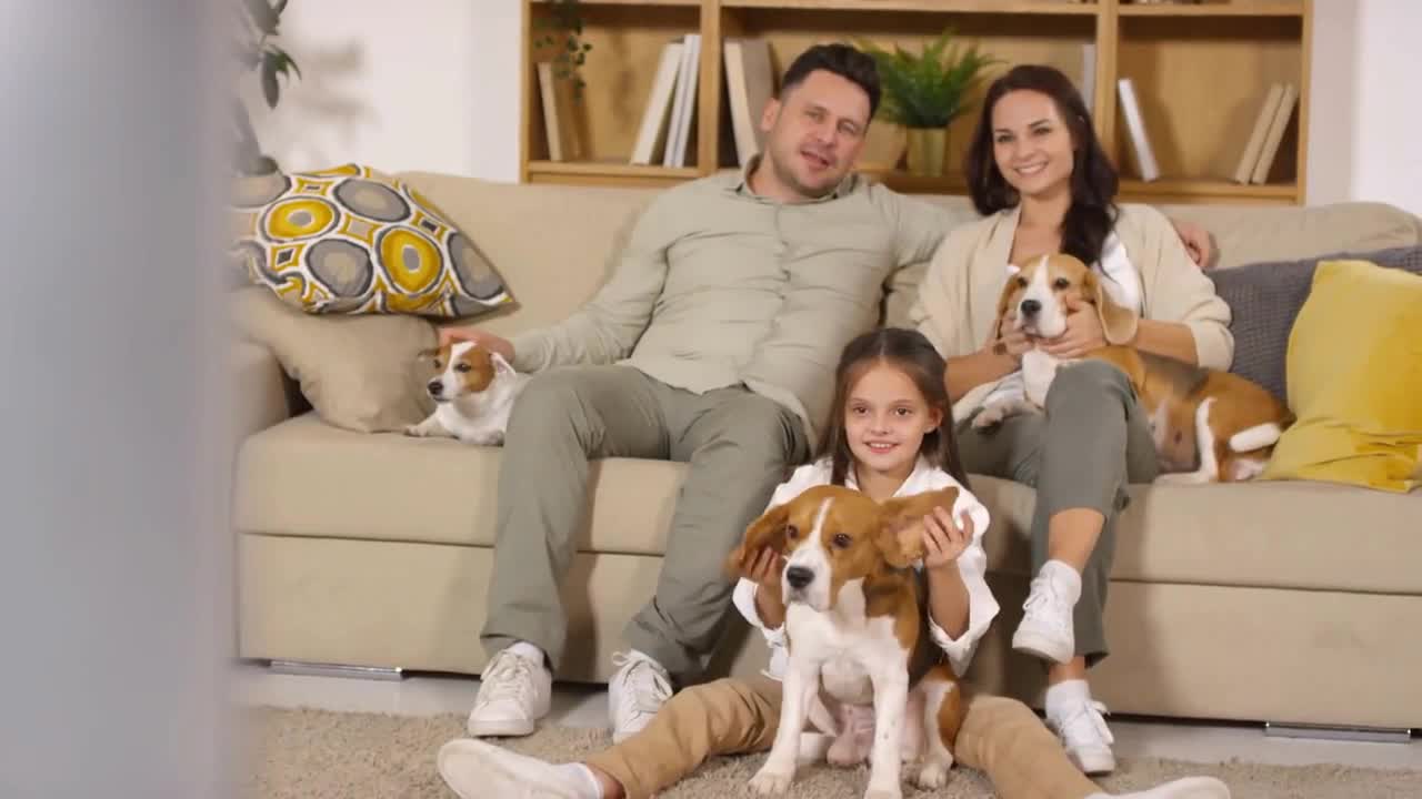 Happy Caucasian family sitting together in the living room