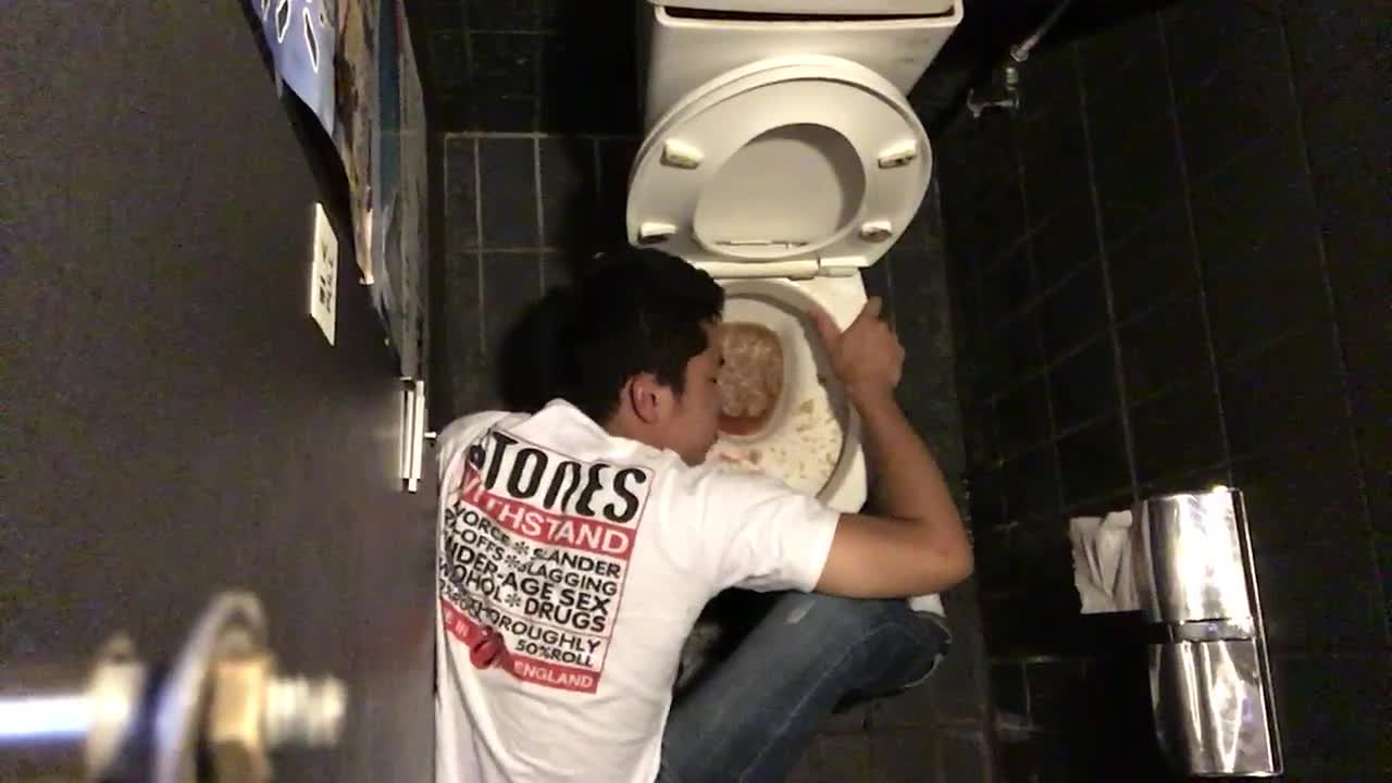 Guy white shirt on ground throwing up in sink