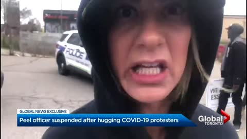 Officer in Ontario suspended after hugging COVID-19 protesters