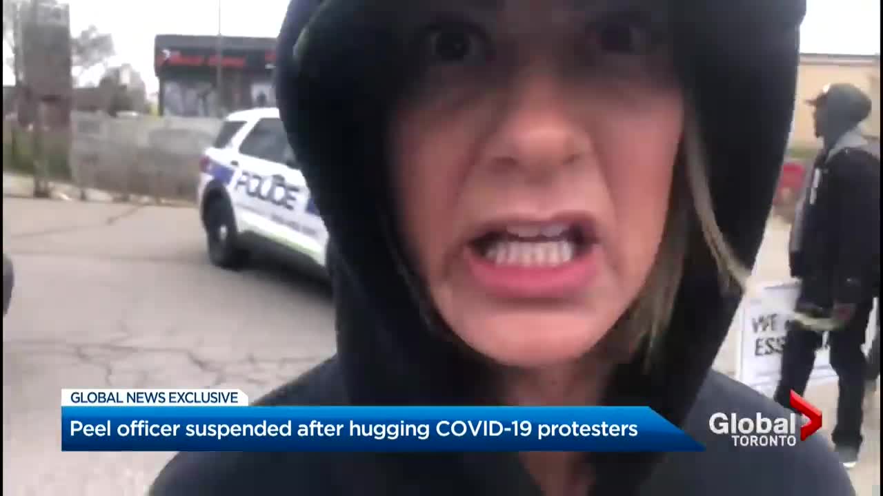 Officer in Ontario suspended after hugging COVID-19 protesters