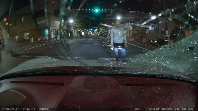 Skateboarder Smashes Windshield