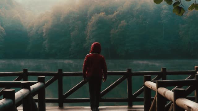 Man on a Pier at a Beautiful River