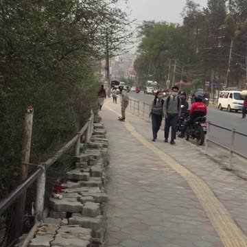 Local boy of Nepal plying with it skateboard