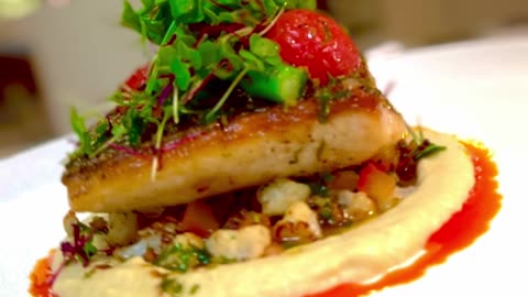 Seabass with pan roasted cauliflower and eggplant puree video description