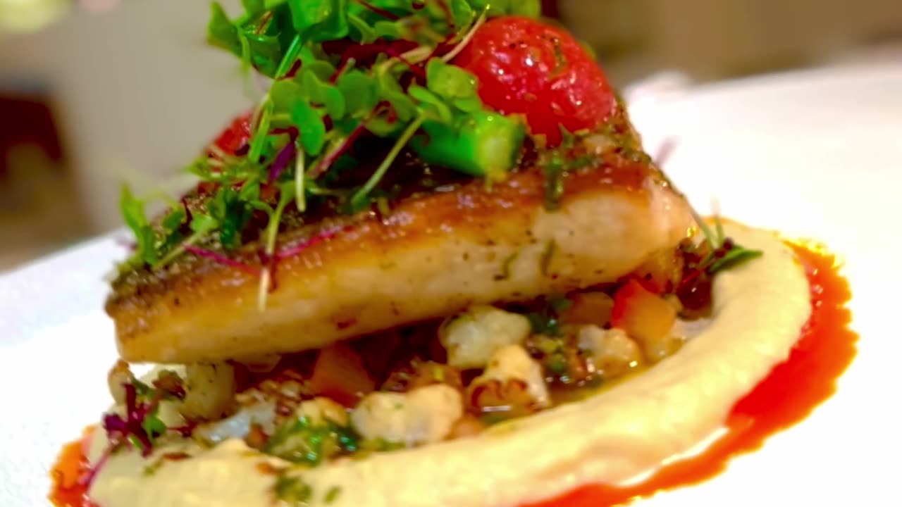 Seabass with pan roasted cauliflower and eggplant puree video description