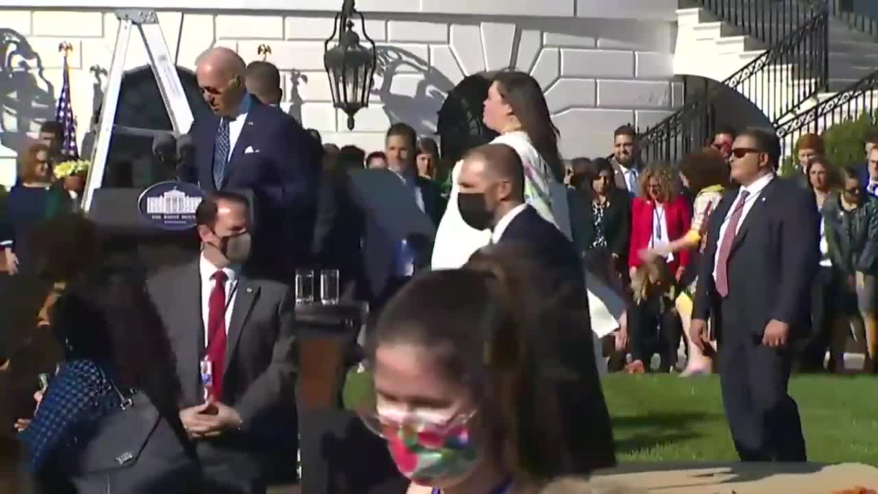 A confused Joe Biden tried to awkwardly talk into microphone over blasting music.