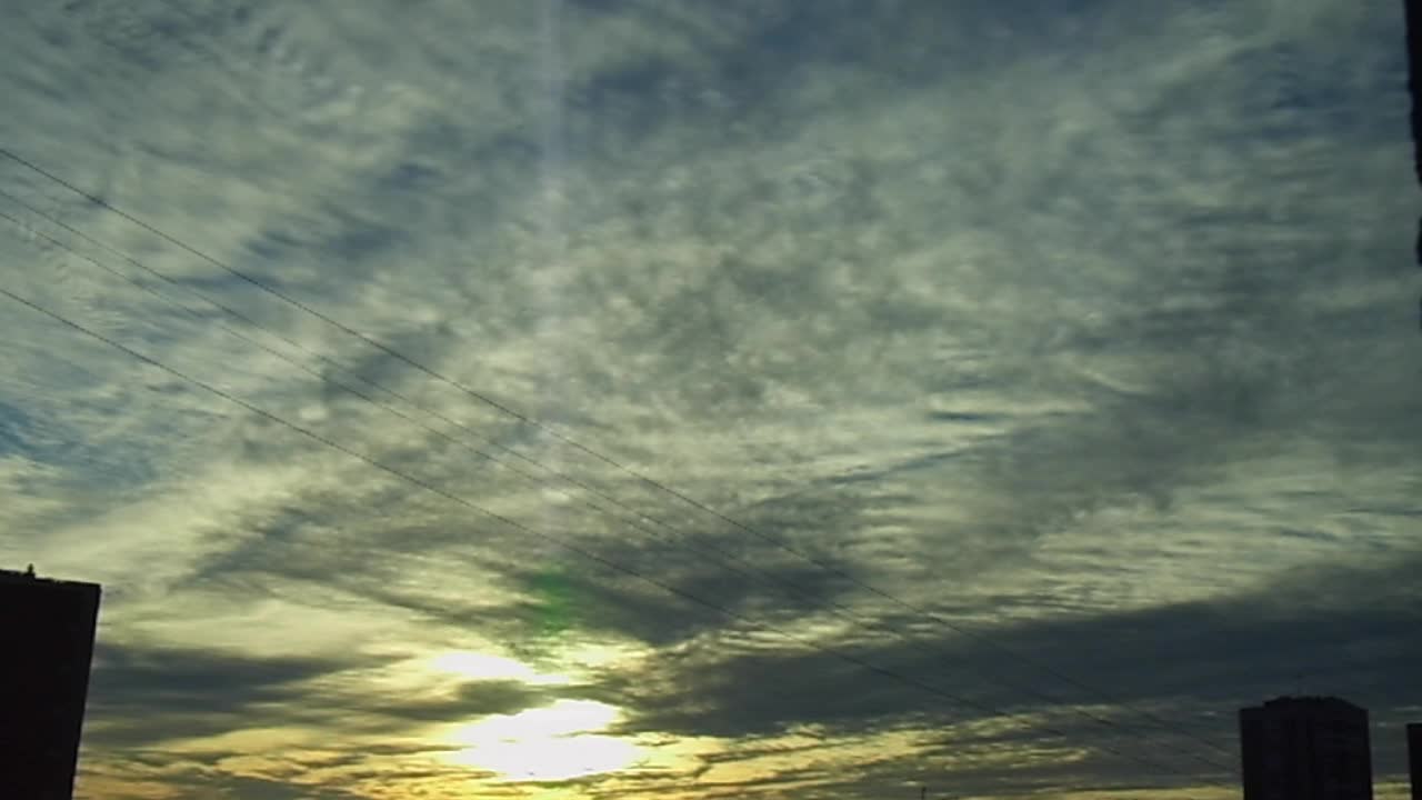 Sunset with orange wavy clouds