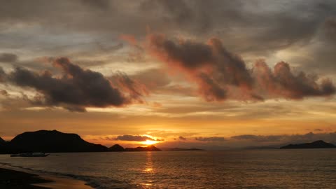 Beach sunset and a mountain silhouette