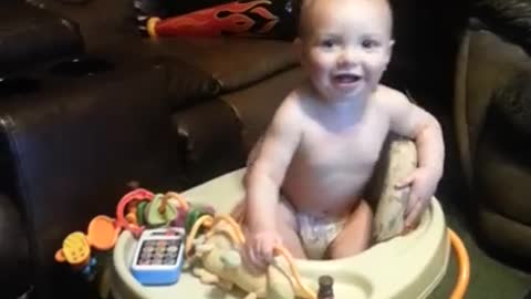 Baby climbs out of chair hits face on desk