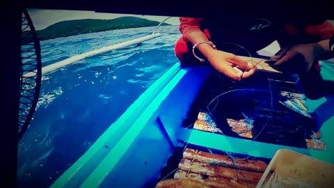 Small girl in the province catches fish for a living