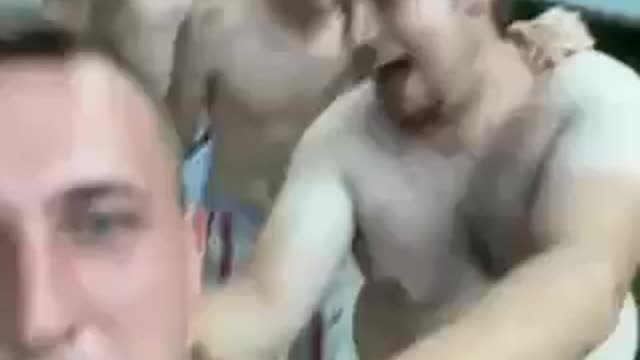 Football players getting drunk ... coach leading them