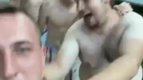 Football players getting drunk ... coach leading them