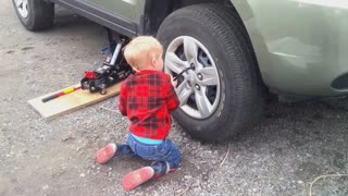 Kids changing the tires. Not so fast or furious.