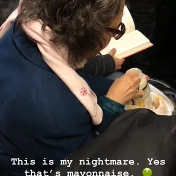 Woman eating mayonnaise on train