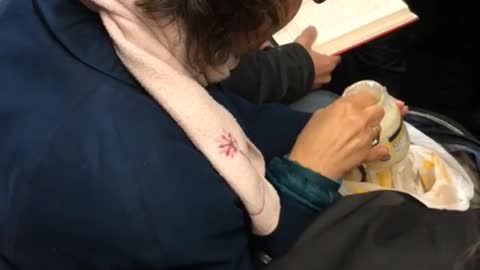 Woman eating mayonnaise on train