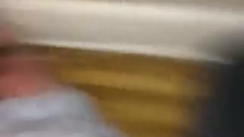 Guy rides broken wooden chair down steps
