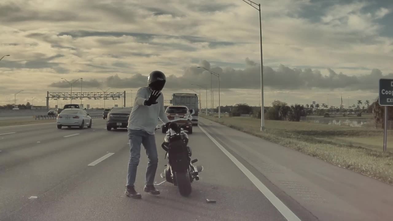 Biker Drops Firearm On Highway