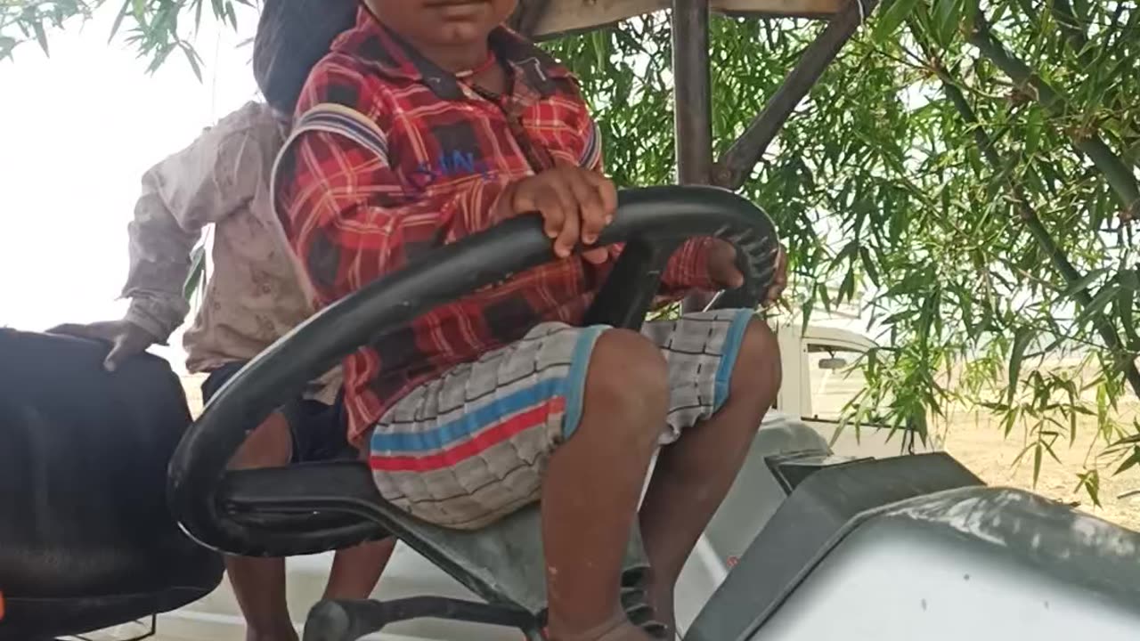 Kid drive tractor