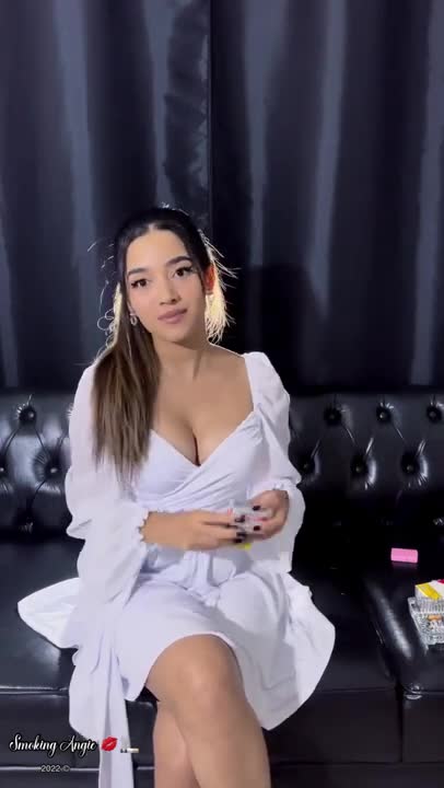 White flowy minidress and a cute smoker smoking and flirting with you ⬇️