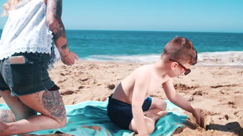 Little baby playing on sea