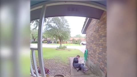 Doorbeel Camera Captures A Man Fall For His Phone