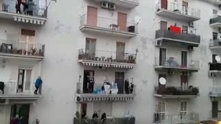 Dance party from the balconies of a neighborhood in Naples