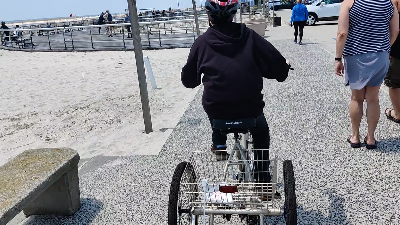 Spencer riding his tricycle at Jones beach air show VID_20230521_125221