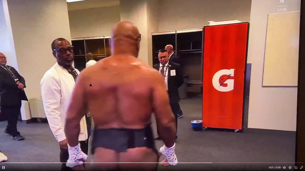 Mike Tyson flashes his bare a$$ on live TV. and made 20 million dollars for fight