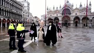 Cancelled Venice carnival marked by masked revellers