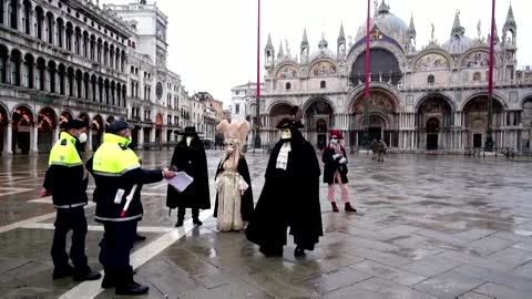 Cancelled Venice carnival marked by masked revellers