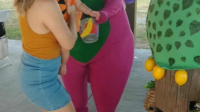 Houston mascot party character Barney picks lemons game at a city ranch birthday celebration