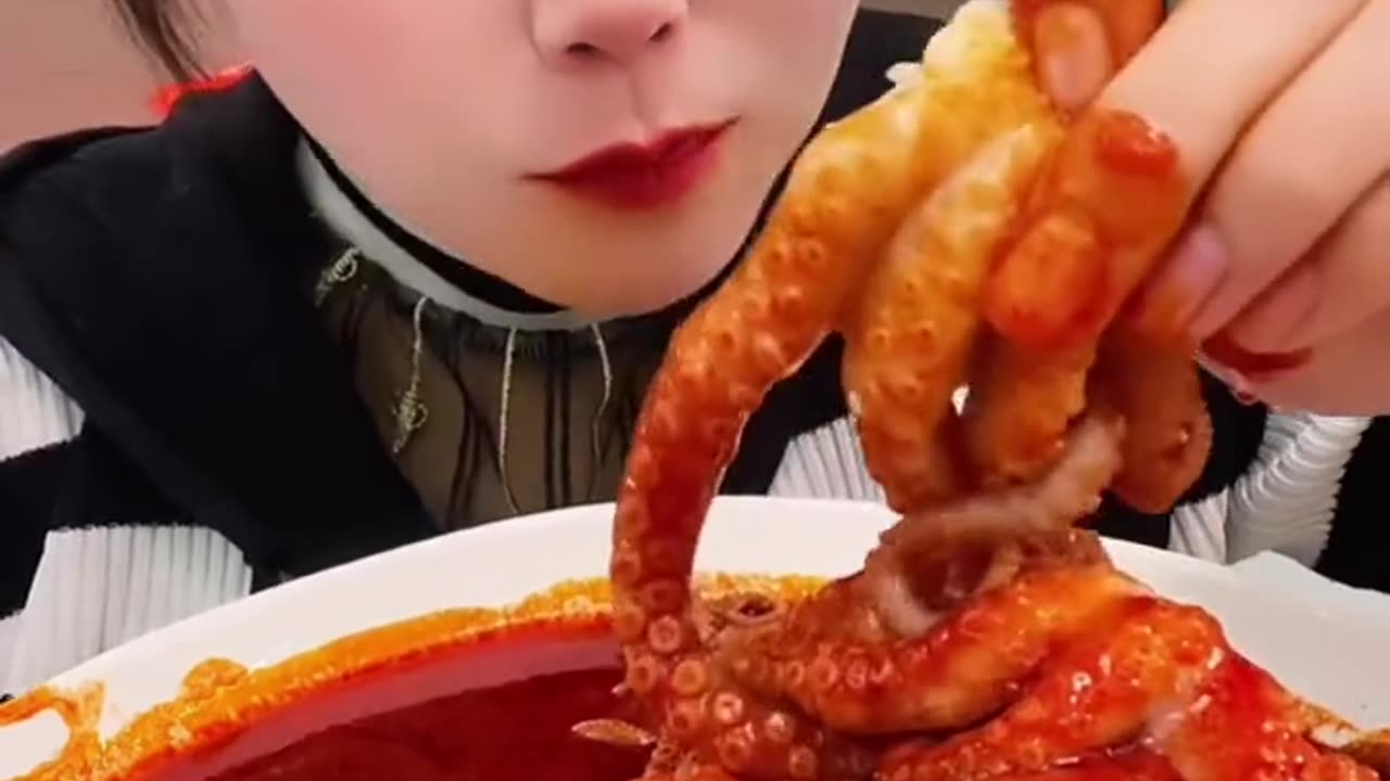 She eating octopus 😐🤤