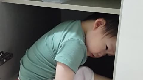 Baby playing in the sink