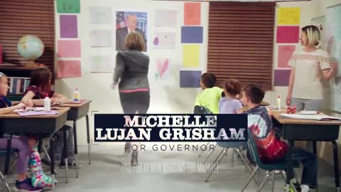 Michelle Lujan Grisham mock's Trump wall