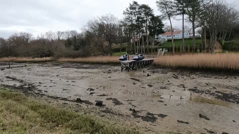 Jet skies next to a river . Low tide. GoPro.