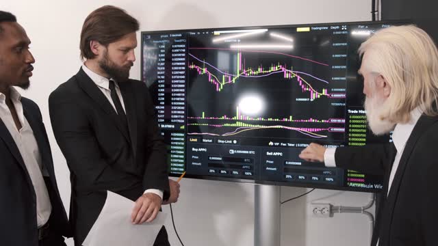 Businessmen Looking to a Chart