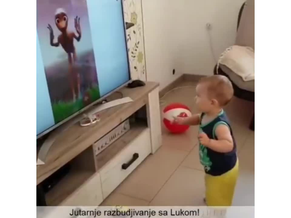 This baby is trying to dance "dame tu cosita"