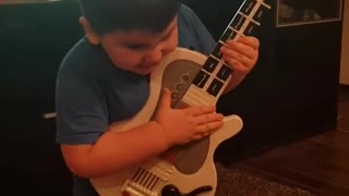 little guitar player