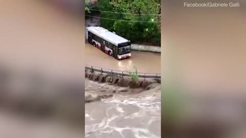 Terrifying moment bus gets swept away by flood water in Italy