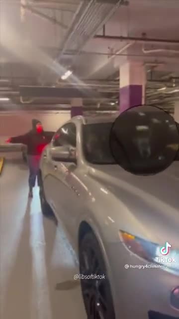 Climate change protestors harass Manchin and blockade his car inside a parking lot.