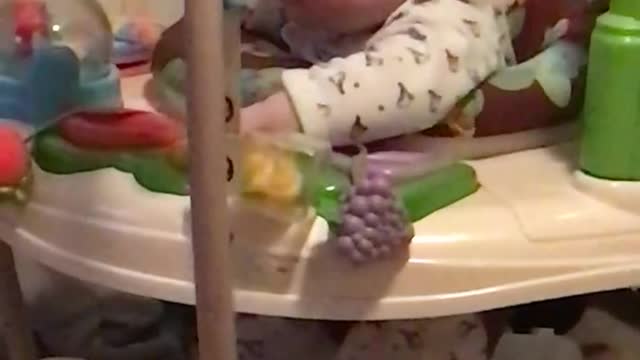 Baby jumping in jumperoo falling asleep