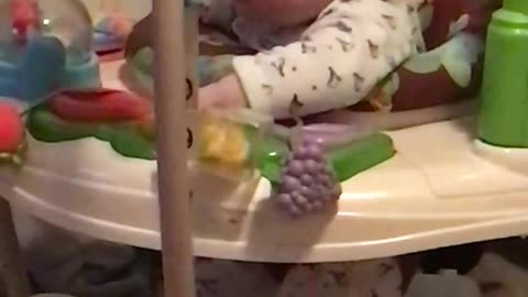 Baby jumping in jumperoo falling asleep